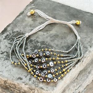 Beaded Bracelet with Gold and Silver Accents black evil eye beads adjustable